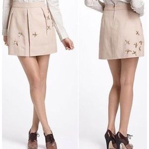 Anthropology gold bird Leif notes tan mini skirt, size 8